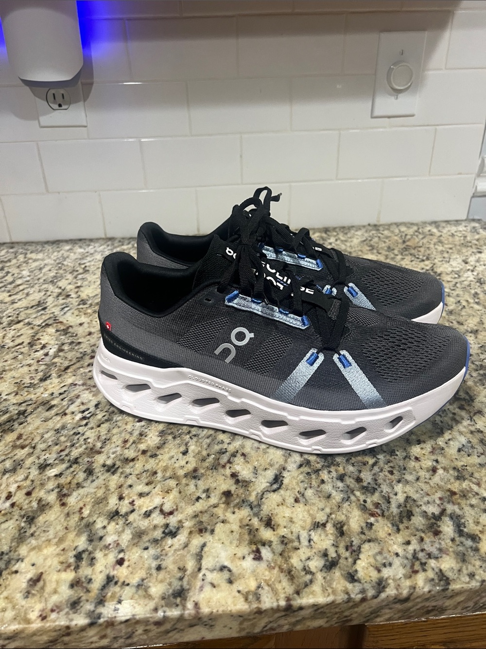 On Running Men's/Women's Trainer in Black and Gray with White Sole